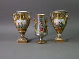 three vases that are sitting on a table