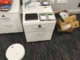 a trash can and a trash can sitting on the floor in a room