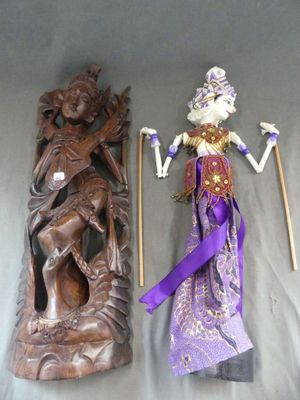 two figurines of a woman and a man on a table