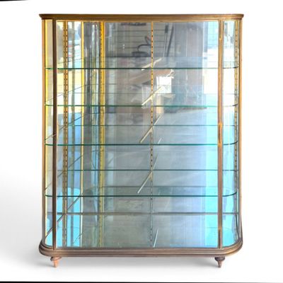 a display case with glass shelves in the middle of it