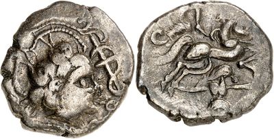 a silver coin with an image of a man riding a horse