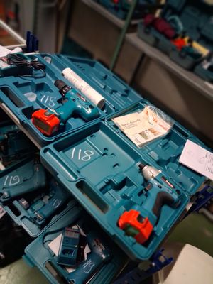 a blue box with tools in it sitting on a table