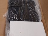 a cardboard box that has a black shirt in it