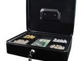 a black briefcase with a bunch of coins inside of it