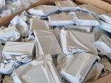 several boxes filled with packages sitting on top of a carpeted floor