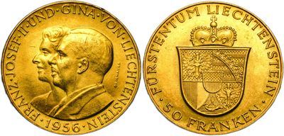 a close up of a gold coin with a crown on it