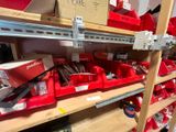 many red bins on the shelves in the store