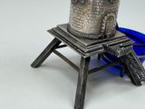a silver statue of a castle on top of a table