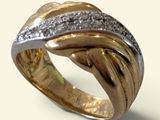 an image of a gold and silver ring with diamonds