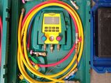 two green boxes with different types of wires in them