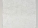 a white linen napkin with a floral design on it