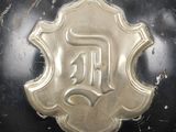 a close up of a helmet with a badge on it