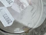 a glass bowl with a label on it and a glass bowl with a label on it
