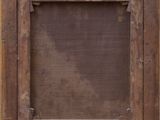 a close up of a wooden frame with a window in the middle