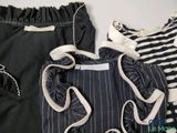 three pieces of clothing are laid out on a white surface