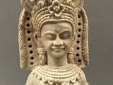 an image of a statue of a woman holding a bird