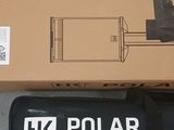 a box that is sitting on the ground next to a remote control