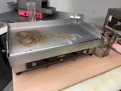 an image of a grill with a lot of food on it