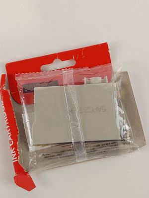 a small package of batteries in a red package