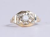 an image of a gold ring with a diamond in the center