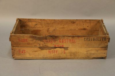 an old wooden crate sitting on top of a white table