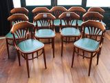 eight chairs in a circle on a wooden floor