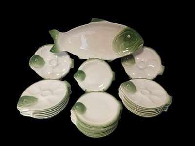 a lot of dishes that are sitting on a table