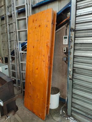 a large wooden door in the middle of a room