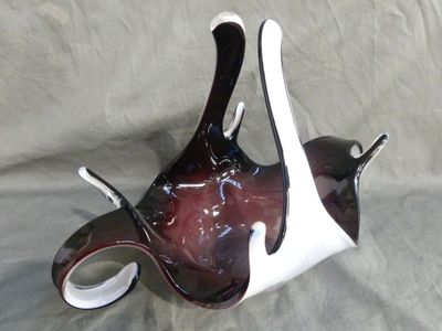 a glass vase with a black and white design on it