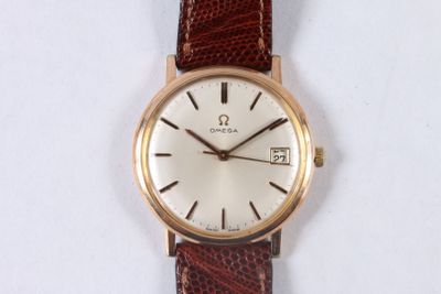 a watch that is sitting on a white surface