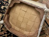 a chair that is sitting on a rug in a room