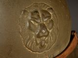 a close up of a helmet with a lion on it