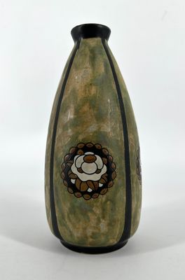 a green vase with a picture of a sheep on it
