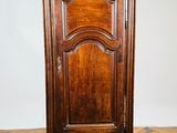 an old wooden cabinet sitting on top of a hard wood floor