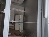 a refrigerator with many boxes in it and a refrigerator door open