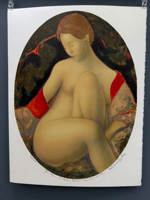 un tableau représentant une femme nue assise sur un canapé