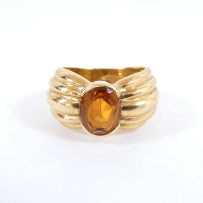 an image of a yellow gold ring with a citrine stone