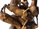 a wooden statue of a horse and rider on a horse
