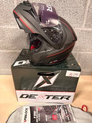 the helmet is sitting on top of the box on the table