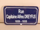 a blue sign that says rue captain alfred dryfuss