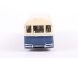a blue and white bus that is on a white surface
