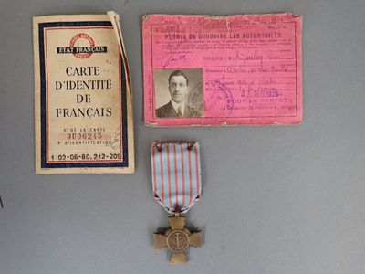 a medal and a card on a table
