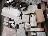 a pile of assorted electronic equipment on a table
