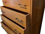 an image of a wooden dresser with drawers and a mirror