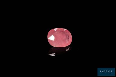 a pink diamond on a black background