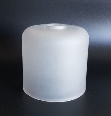 an image of a frosted glass container on a black surface