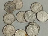 a lot of coins that are sitting on a table
