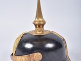 a black and gold helmet with a golden top
