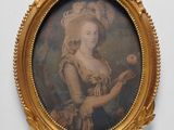 portrait of a lady holding a rose in a gold frame