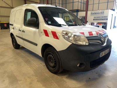 a white van with red stripes parked inside of a building